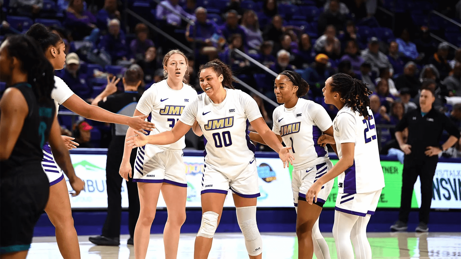 peyton mcdaniel high fives teammates